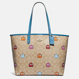 Coach Reversible City Tote in Signature Canvas with PacMan Ghosts Print-One Quarter